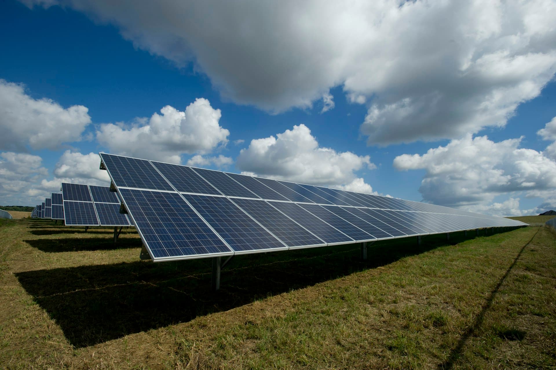 Clean solar panels on a residential roof under blue sky
